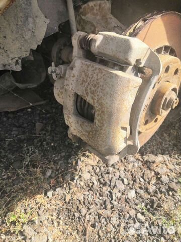 Передний левый тормозной суппорт Дэу Нексия Daewoo